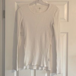 Long sleeve, white t-shirt with slits on the side.